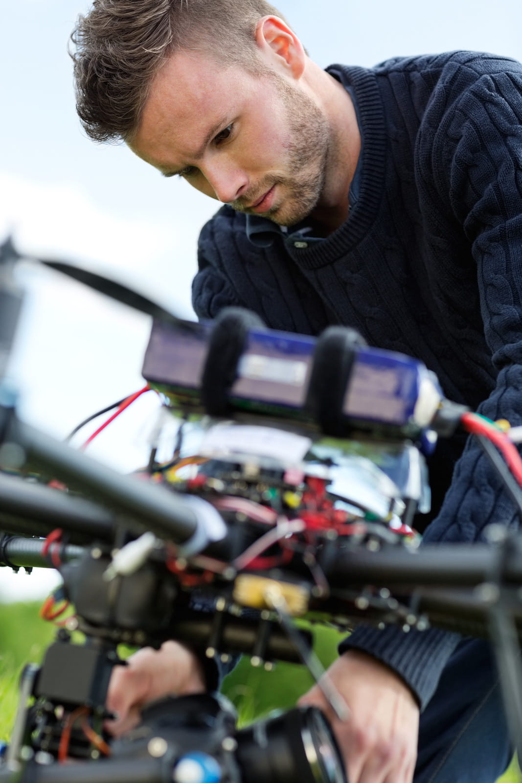 Engineers assembling an agricultural drone in a modern Cork manufacturing workshop